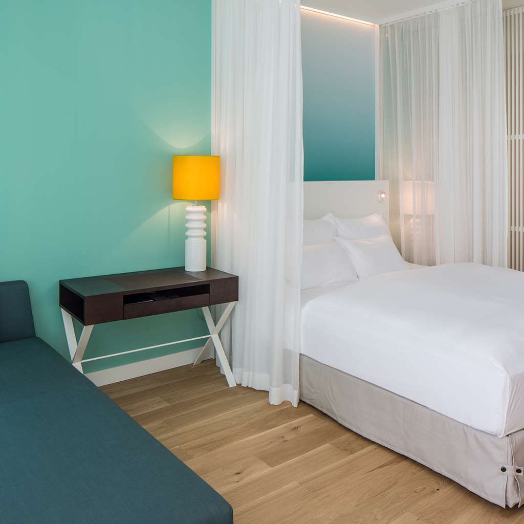 Falkensteiner Hotel & Spa Jesolo Camera foto A bedroom at the hotel